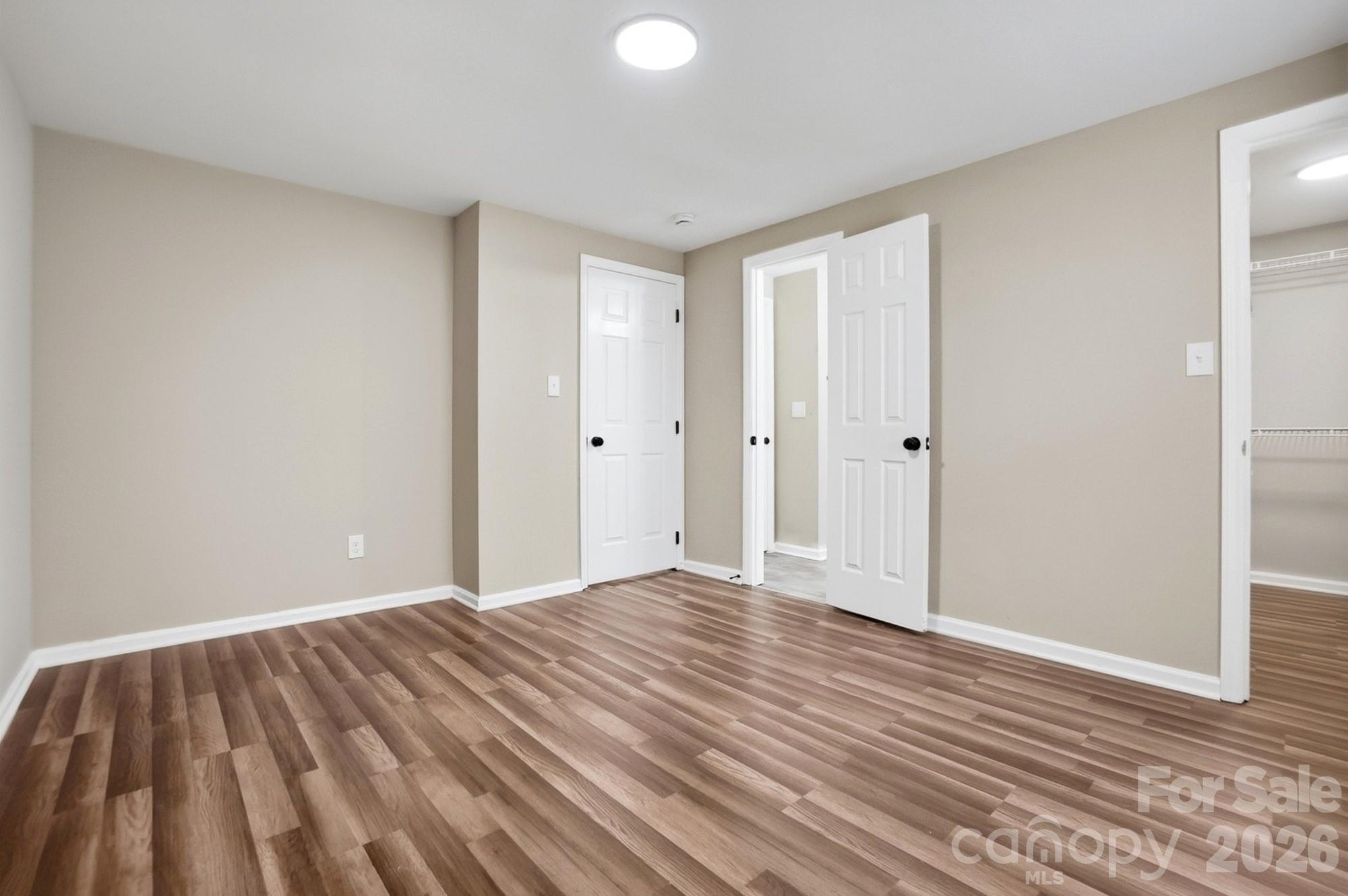 6621 Piney Path Road Charlotte, NC 28212 - Photo 11 of 36 a view of an empty room and wooden floor