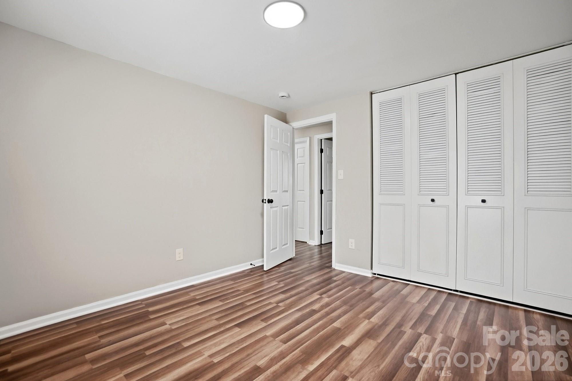 6621 Piney Path Road Charlotte, NC 28212 - Photo 17 of 36 a view of an empty room with wooden floor
