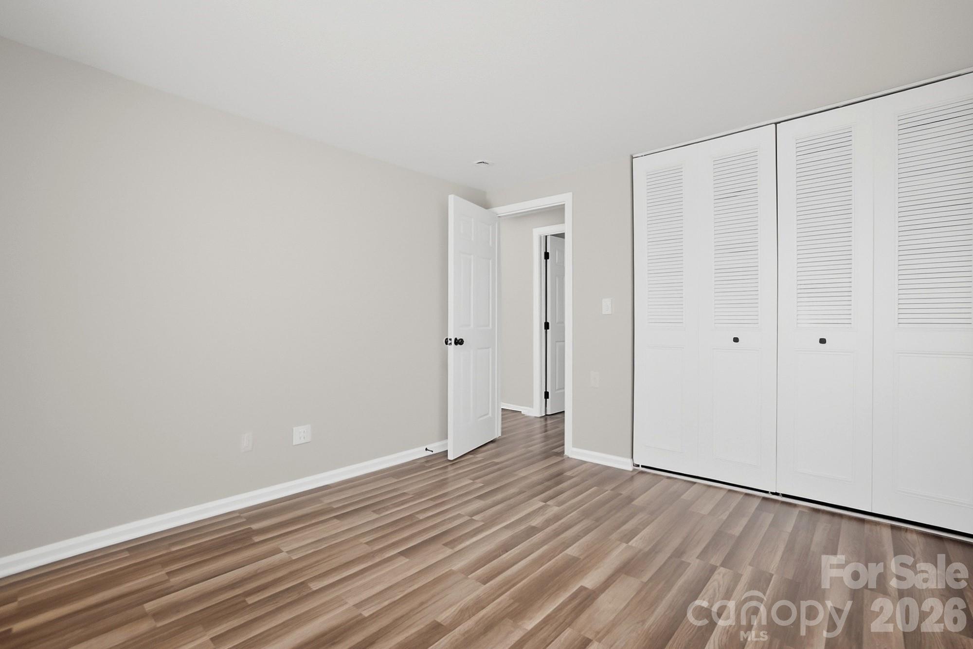 6621 Piney Path Road Charlotte, NC 28212 - Photo 18 of 36 a view of an empty room with wooden floor