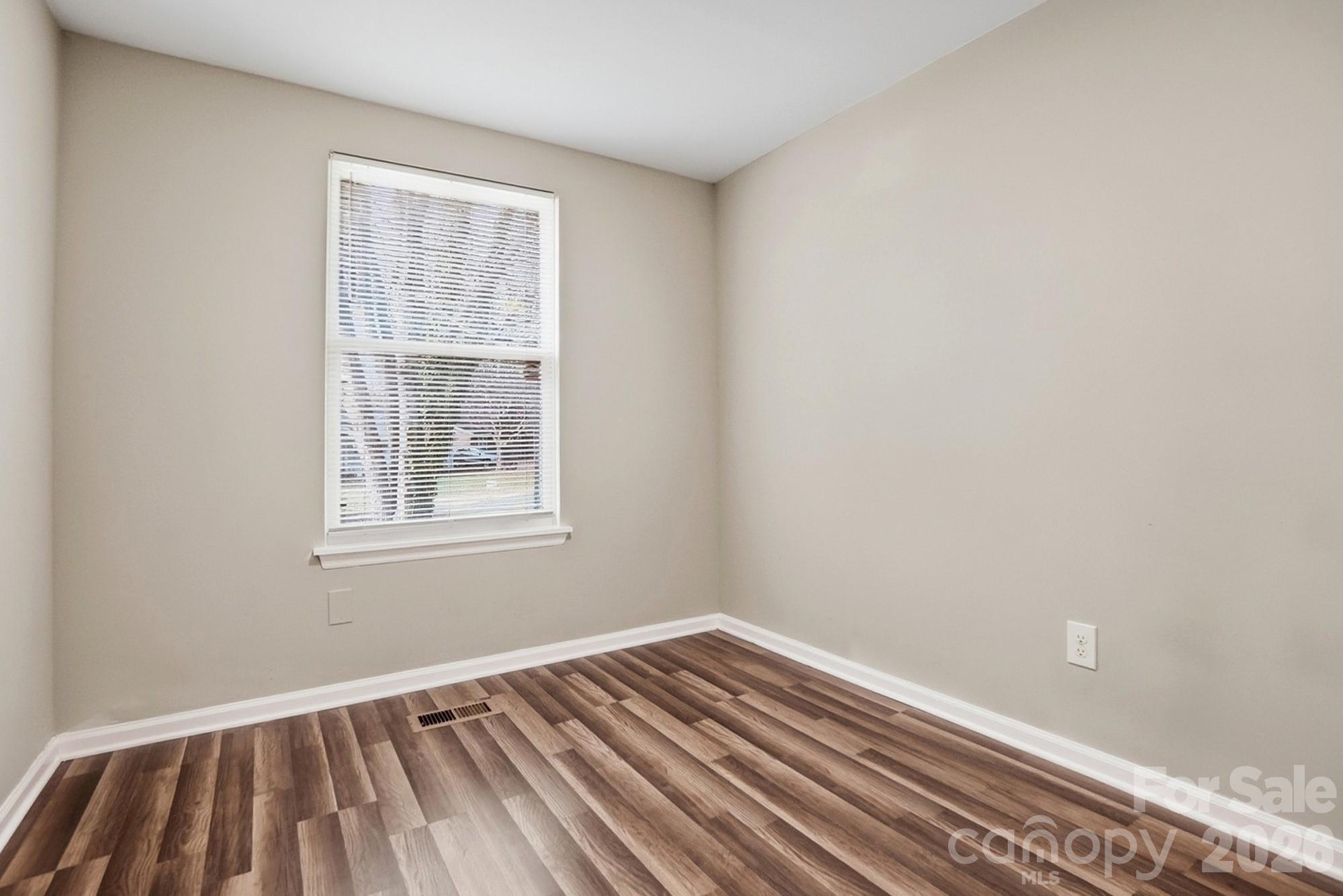 6621 Piney Path Road Charlotte, NC 28212 - Photo 19 of 36 an empty room with a window