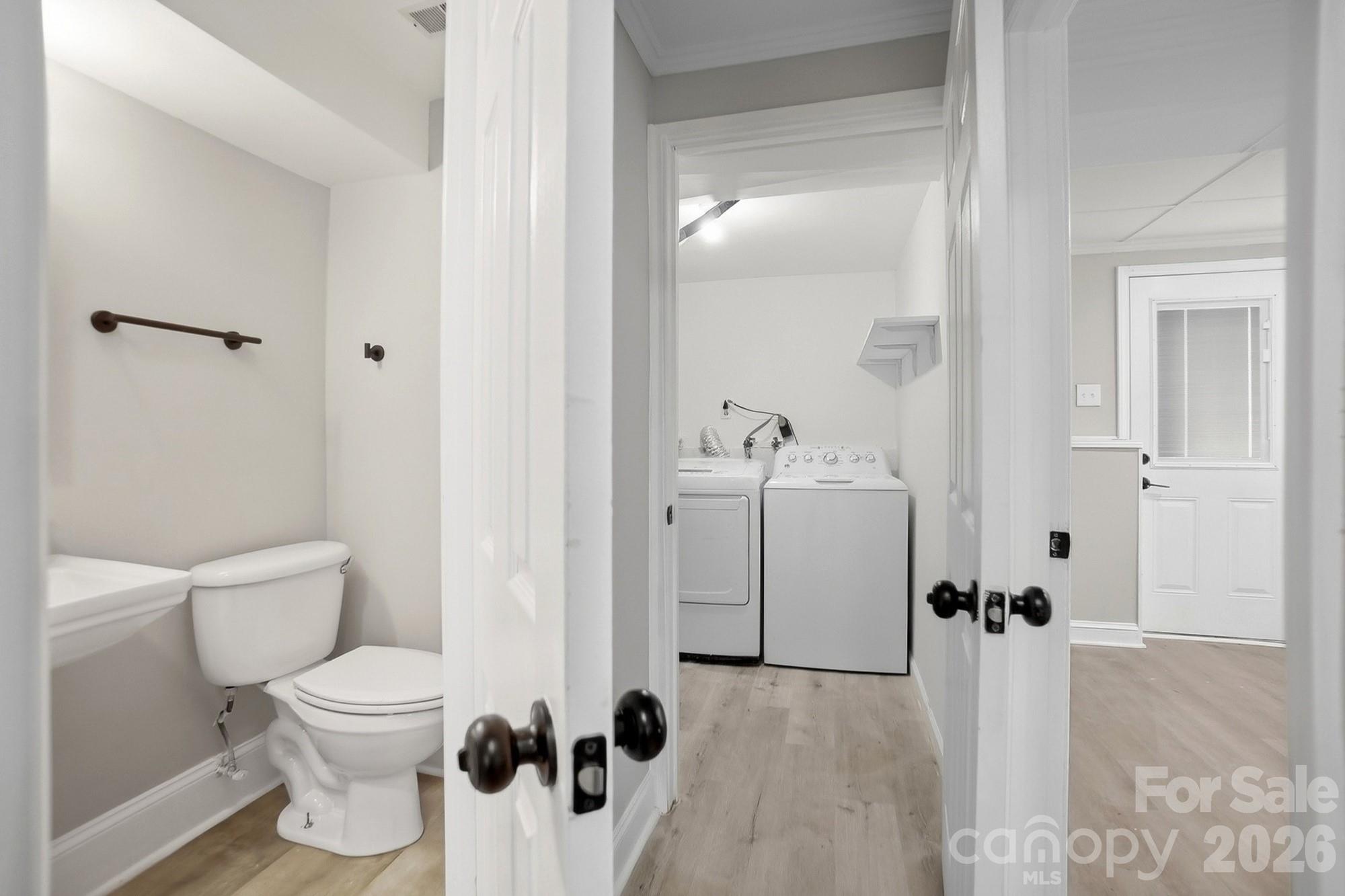 6621 Piney Path Road Charlotte, NC 28212 - Photo 22 of 36 a bathroom with a toilet sink and shower
