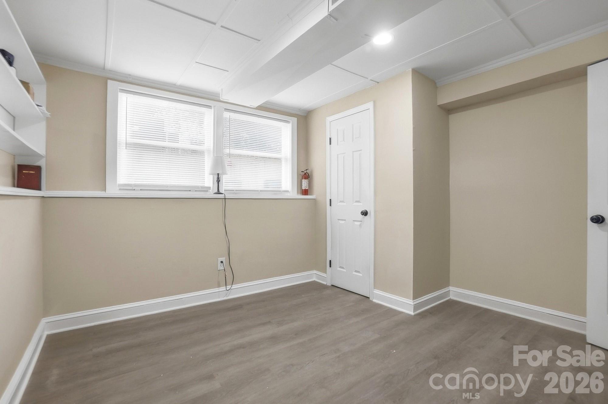 6621 Piney Path Road Charlotte, NC 28212 - Photo 29 of 36 an empty room with wooden floor and windows