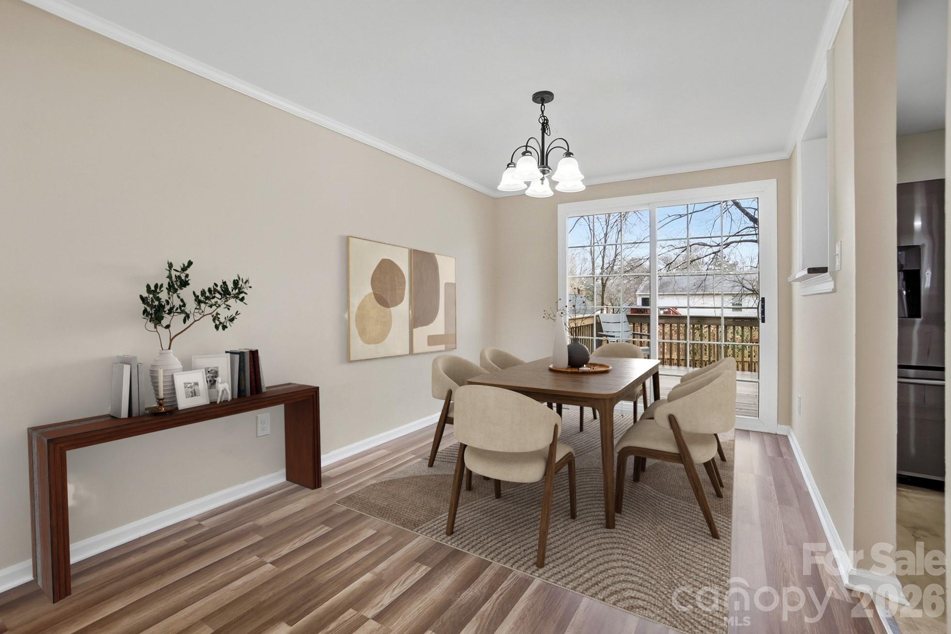 6621 Piney Path Road Charlotte, NC 28212 - Photo 3 of 36 a view of a dining room with furniture window and wooden floor