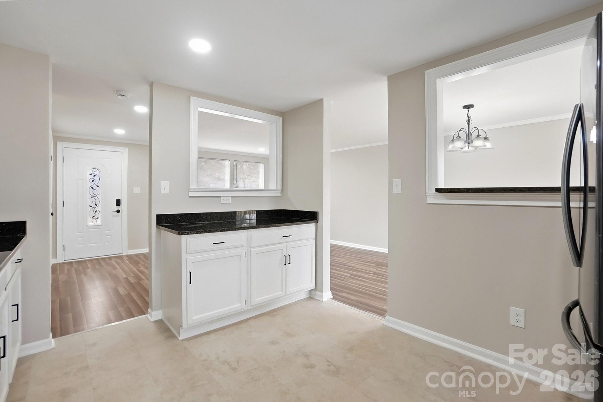 6621 Piney Path Road Charlotte, NC 28212 - Photo 7 of 36 a bathroom with a sink a mirror and a shower