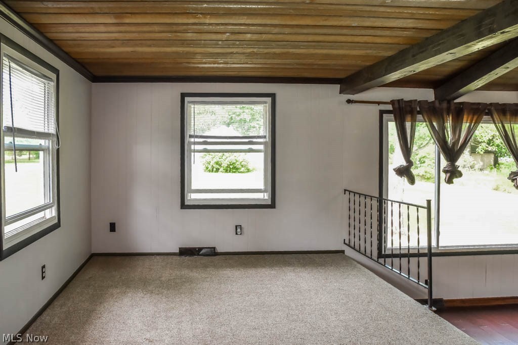 3703 Johnson Road Norton, OH 44203 - Photo 8 of 24 The dining room has crown molding and wood plank ceiling. You could also use this room as an office.