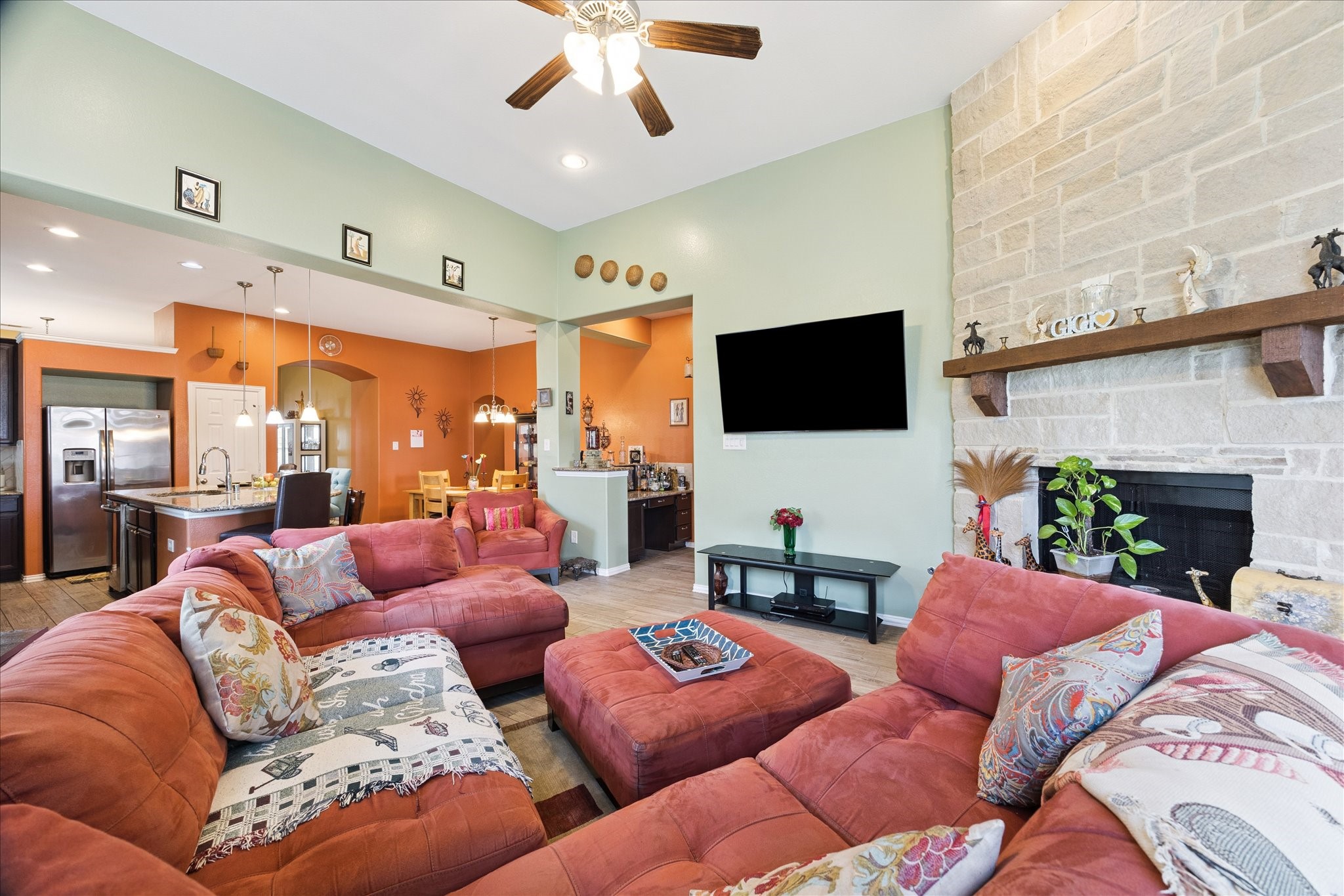13117 Green Shores Lane Rosharon, TX 77583 - Photo 11 of 30 a living room with fireplace furniture and a flat screen tv