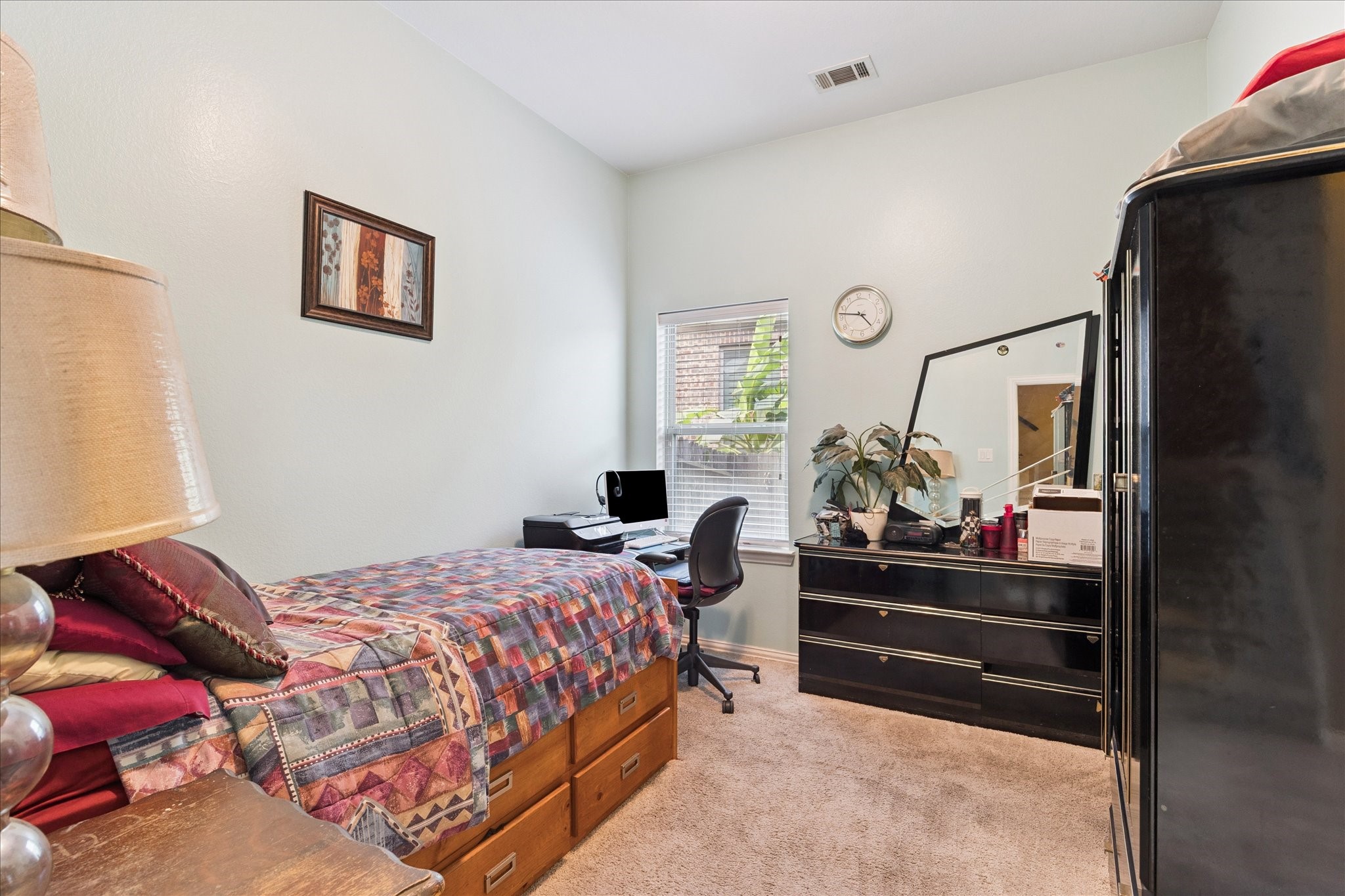 13117 Green Shores Lane Rosharon, TX 77583 - Photo 23 of 30 a bedroom with a bed and dresser