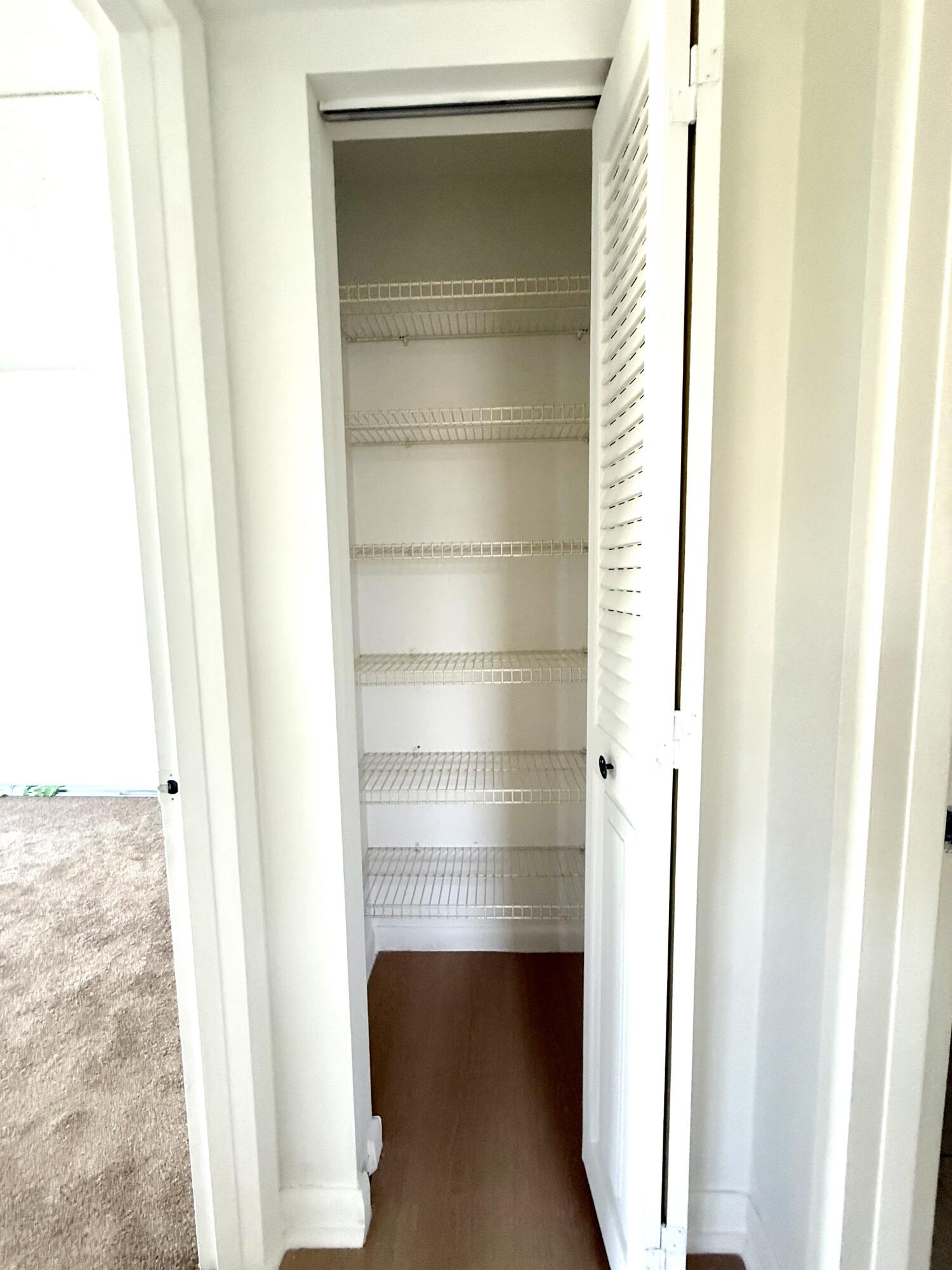 402 Brighton J, Unit J Boca Raton, FL 33434 - Photo 14 of 21 a view of closet area