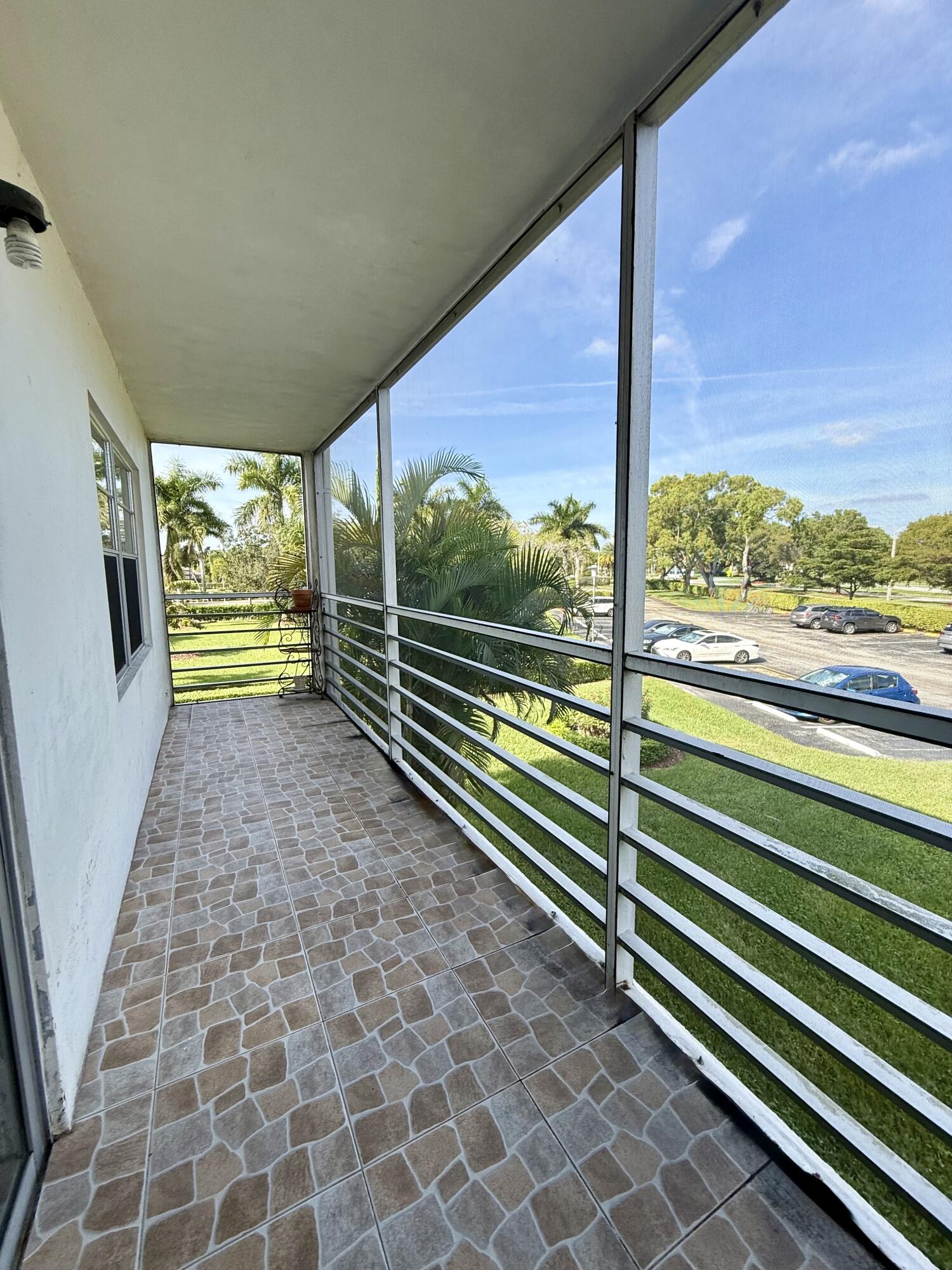 402 Brighton J, Unit J Boca Raton, FL 33434 - Photo 20 of 21 a view of railway station with a porch