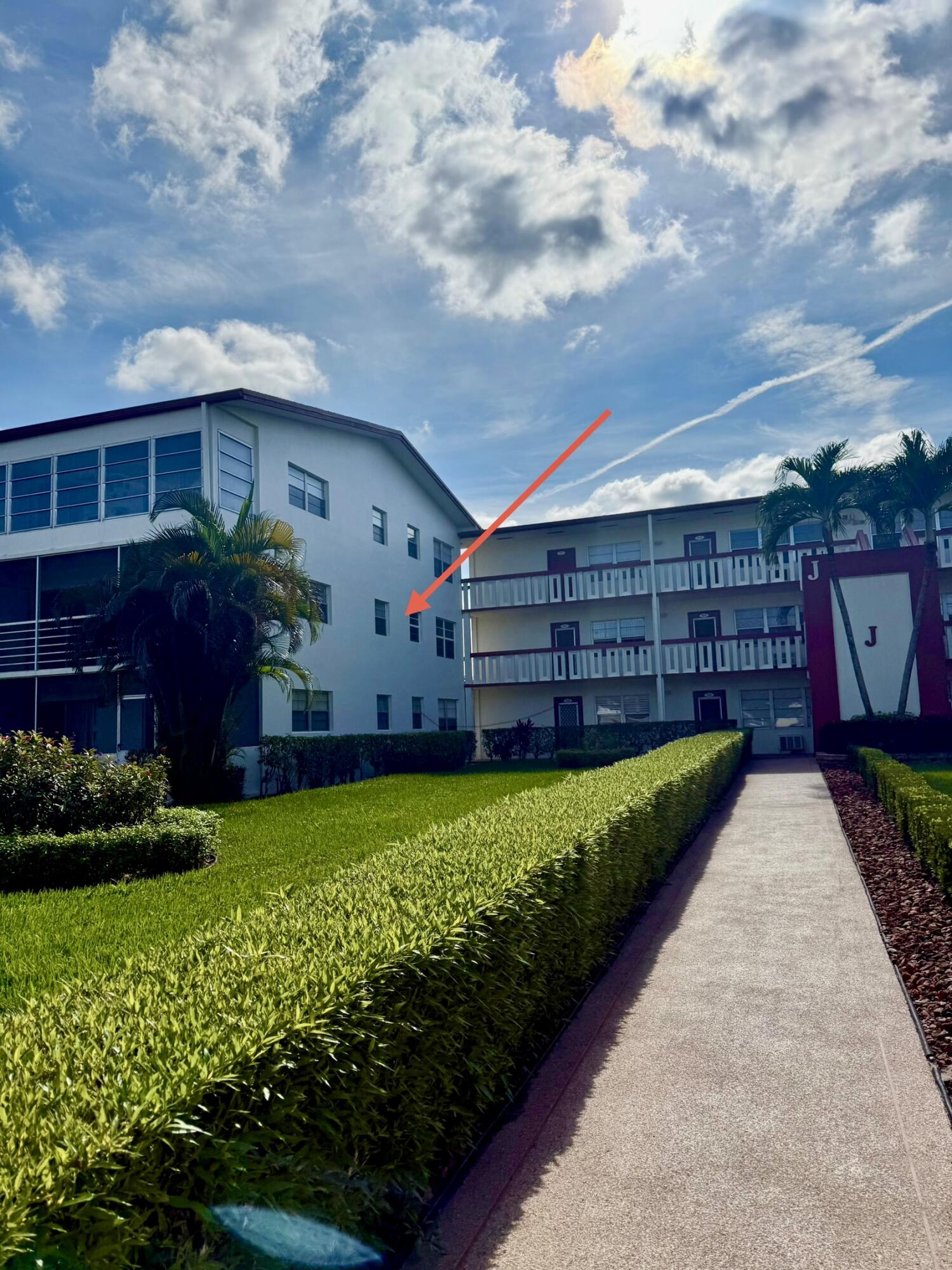 402 Brighton J, Unit J Boca Raton, FL 33434 - Photo 4 of 21 a view of a house with a yard