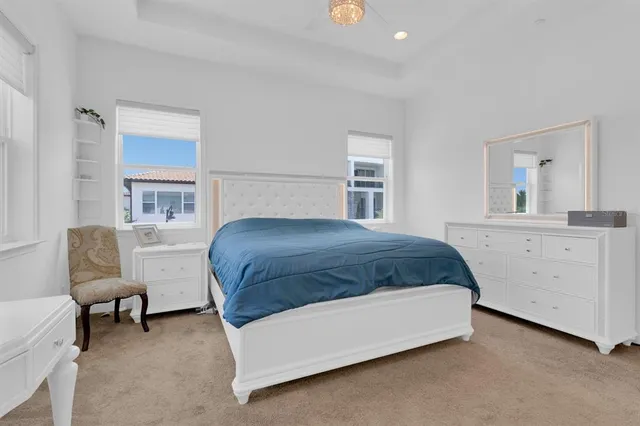a bathroom with a granite countertop sink and a toilet