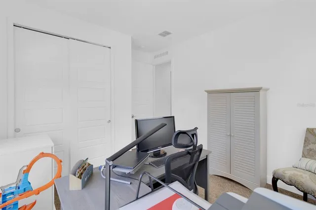 a utility room with cabinets
