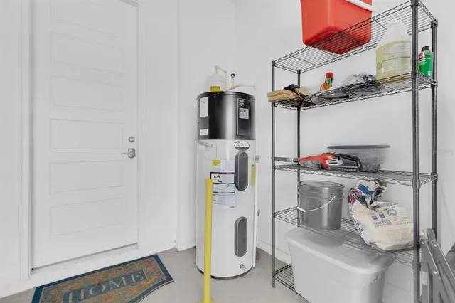 a front view of a house with a yard garage and outdoor seating