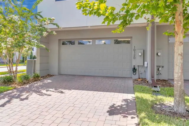 an aerial view of a houses with a lake view