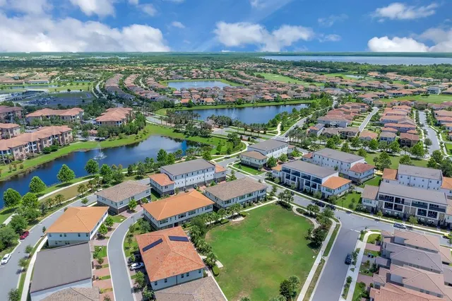 an aerial view of house with yard