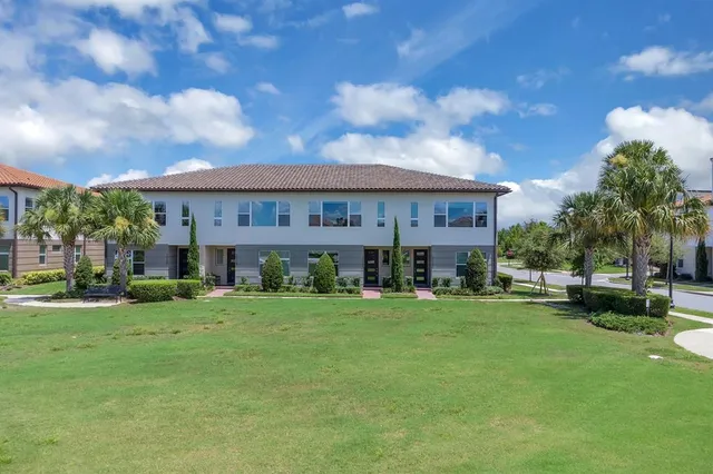 an aerial view of a residential houses with city view and lake view