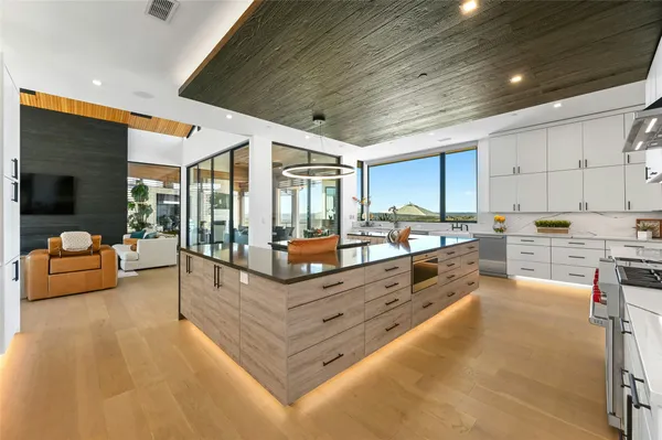 a large living room with stainless steel appliances granite countertop lots of counter top space