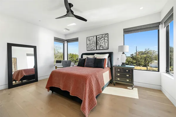 a bedroom with a large bed and a window