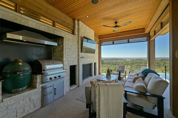 a living room with furniture and a floor to ceiling window