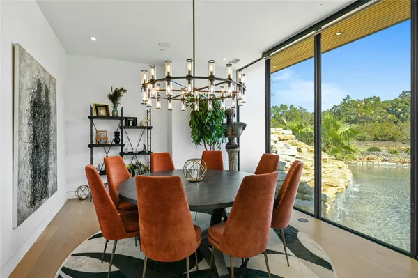a view of a dining room with furniture window and wooden floor