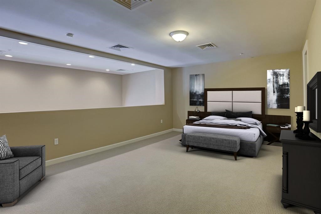 914 Main Street, Unit 1107 Houston, TX 77002 - Photo 3 of 14 a spacious bedroom with a bed and a couch