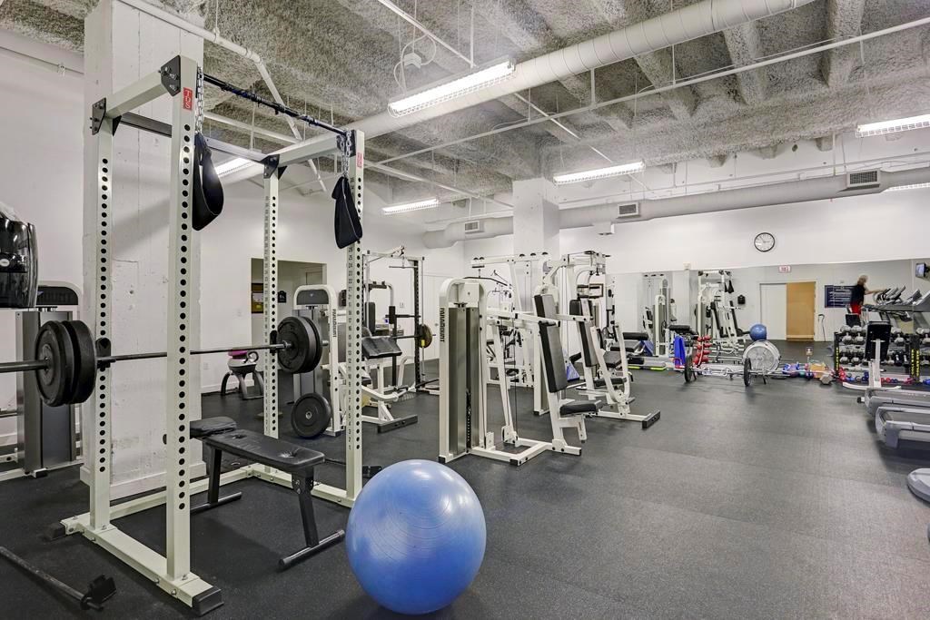 914 Main Street, Unit 1107 Houston, TX 77002 - Photo 7 of 14 a view of a room with gym equipment
