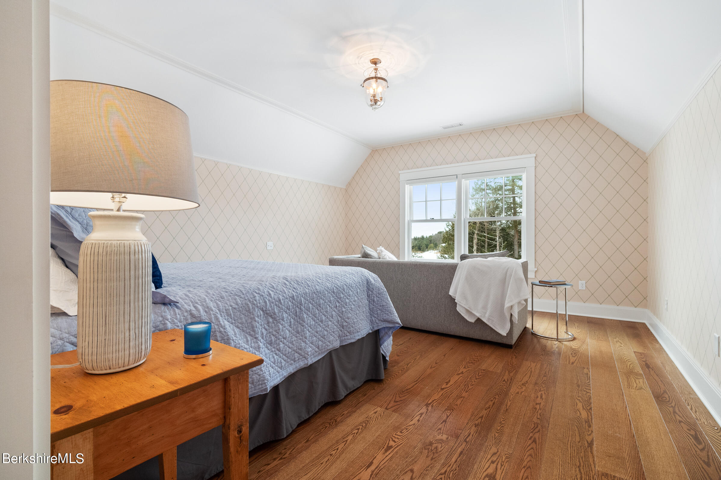 707 Stratford Road New Marlborough, MA 01259 - Photo 57 of 72 a bedroom with a bed and wooden floor