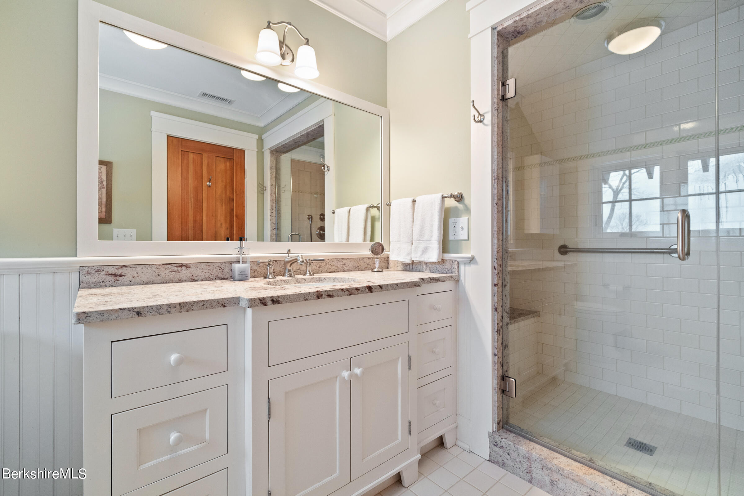 707 Stratford Road New Marlborough, MA 01259 - Photo 59 of 72 a bathroom with a granite countertop sink a mirror and a shower