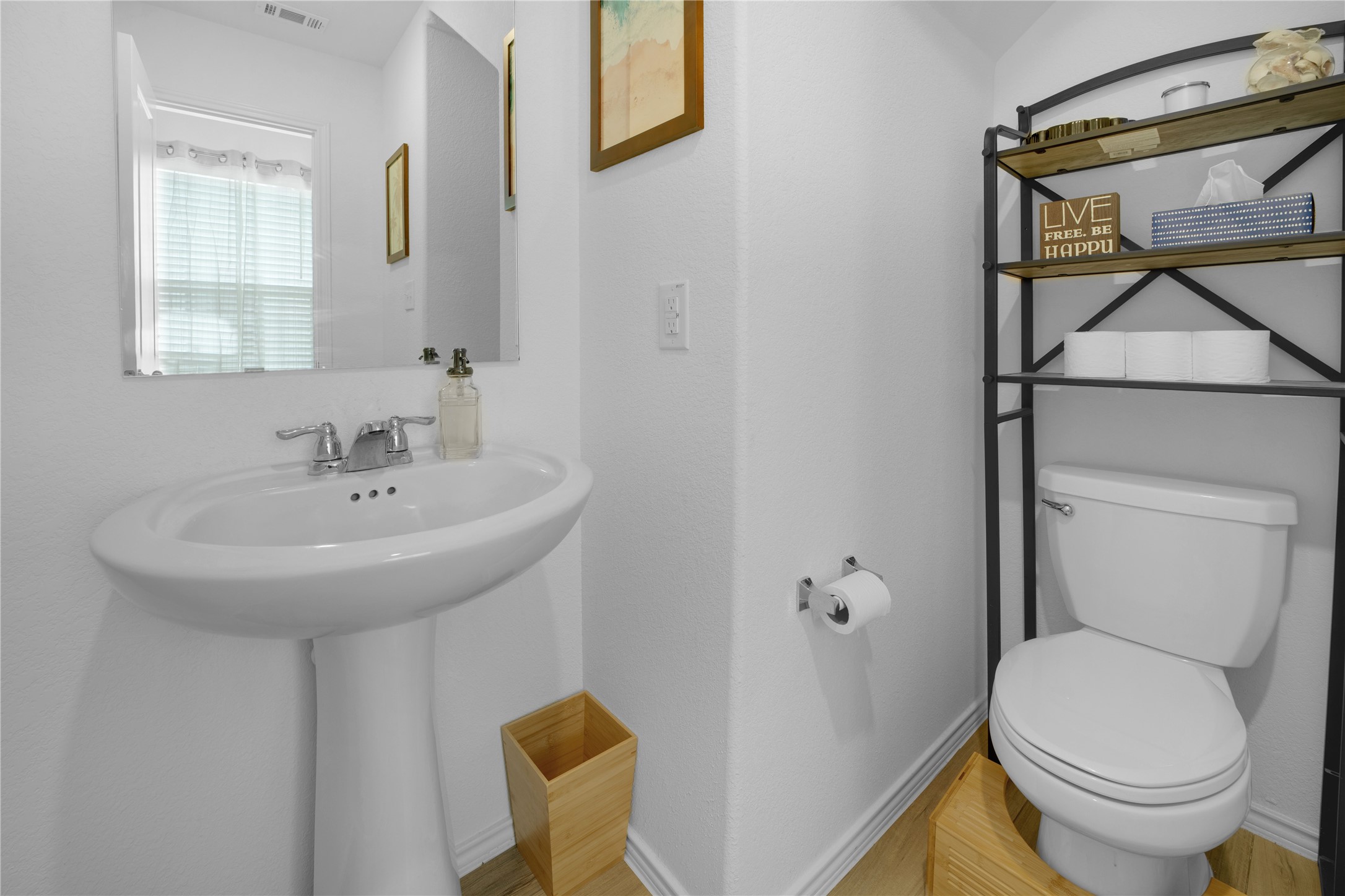 36 Trinity Circle Lockhart, TX 78644 - Photo 11 of 36 a bathroom with a sink a toilet and a mirror