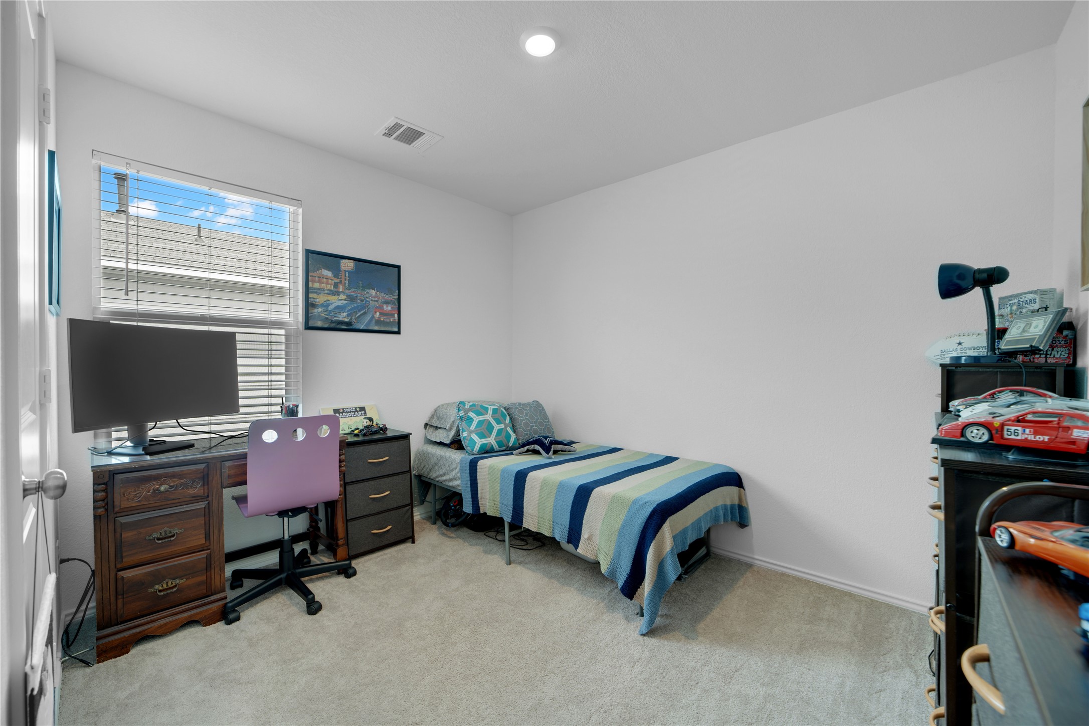 36 Trinity Circle Lockhart, TX 78644 - Photo 25 of 36 a bedroom with bed and a flat screen tv
