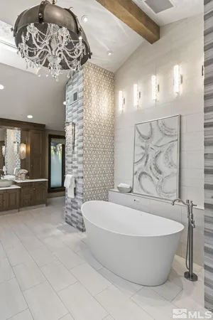 a bathroom with a bathtub and shower