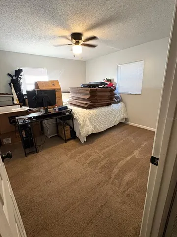 a bedroom with a bed and furniture