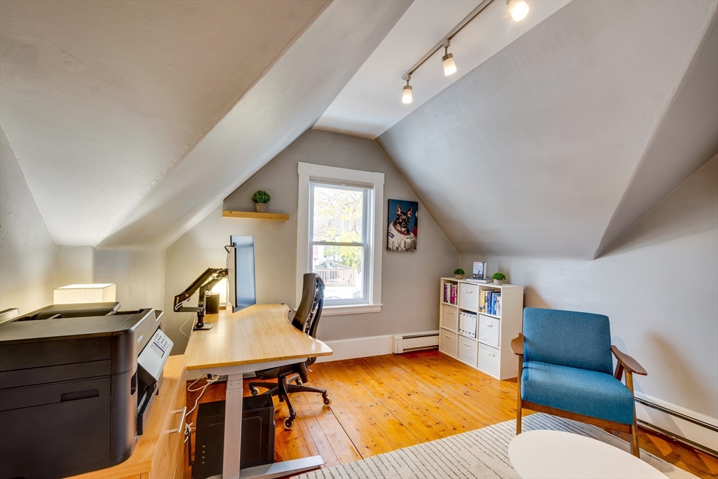 10 Eaton Street Reading, MA 01867 - Photo 14 of 15 a view of a livingroom with furniture and a dining table