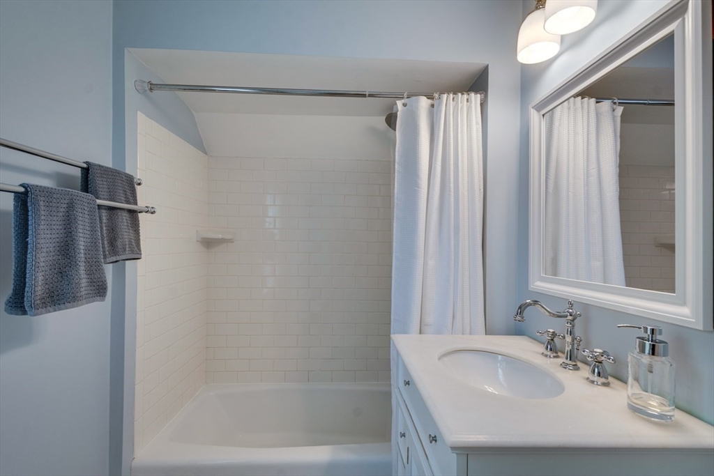 10 Eaton Street Reading, MA 01867 - Photo 15 of 15 a bathroom with a sink and a mirror
