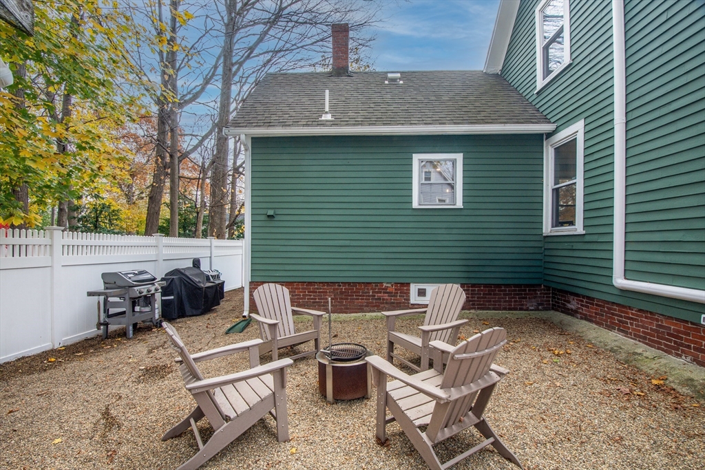 10 Eaton Street Reading, MA 01867 - Photo 3 of 15 a view of backyard of house with seating space