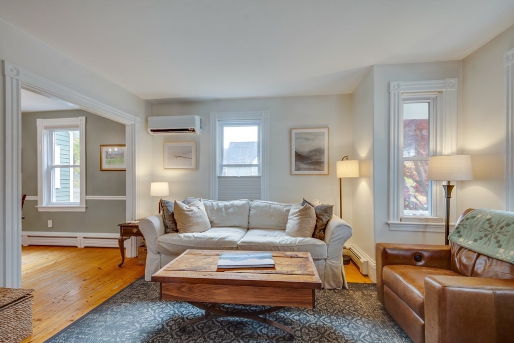 10 Eaton Street Reading, MA 01867 - Photo 7 of 15 a living room with furniture and a couch