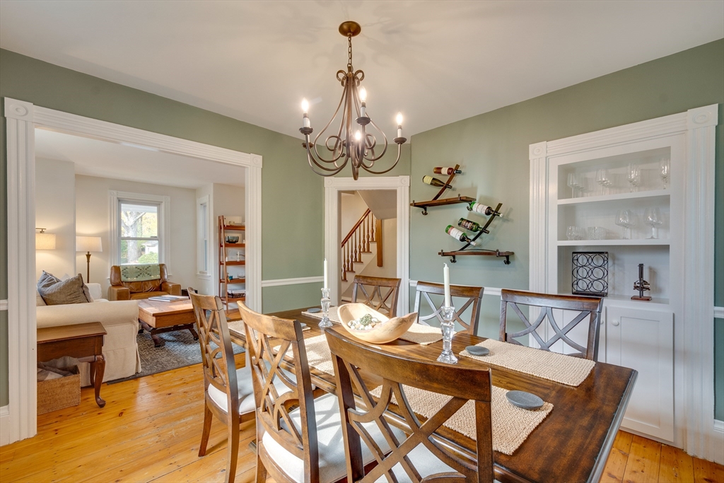10 Eaton Street Reading, MA 01867 - Photo 8 of 15 a view of a dining room with furniture wooden floor and chandelier