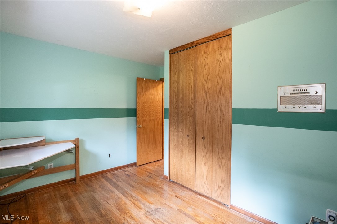 4962 Nettleton Road Medina, OH 44256 - Photo 28 of 43 Unfurnished bedroom with wood finished floors and a closet