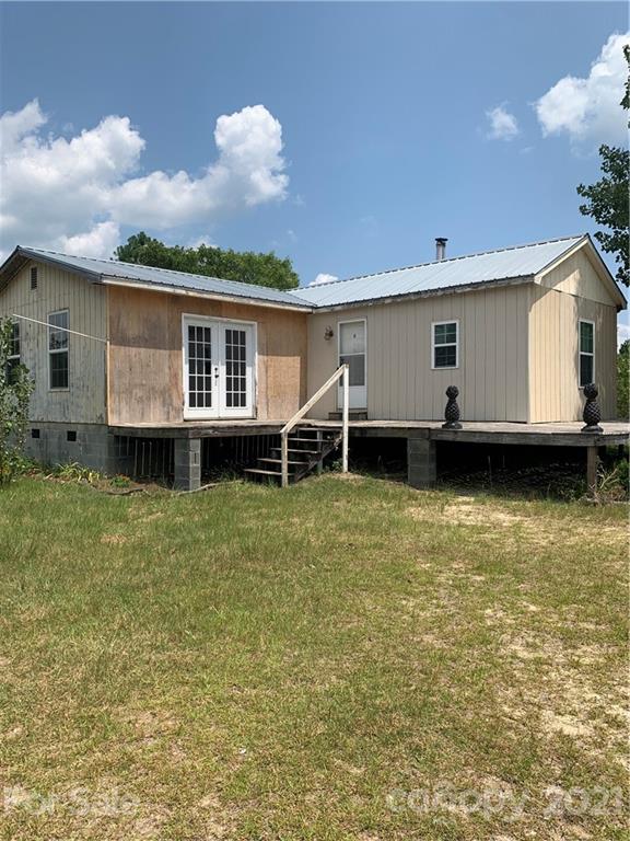 1787 St John Church Road Patrick, SC 29584 - Photo 18 of 48 a view of a house with a backyard and a table