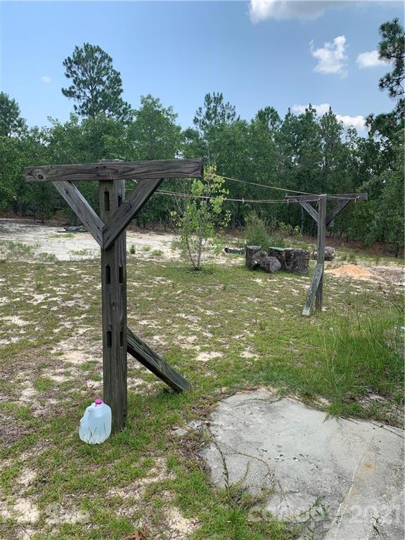 1787 St John Church Road Patrick, SC 29584 - Photo 43 of 48 a view of a wooden floor and a yard in the back