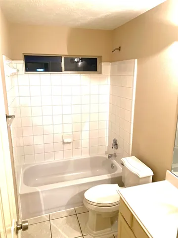 a view of an entryway with wooden floor door and windows