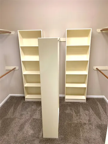 a view of an empty room with a empty shelves