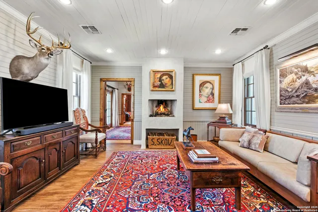 a kitchen with stainless steel appliances granite countertop a sink a stove a washer and dryer