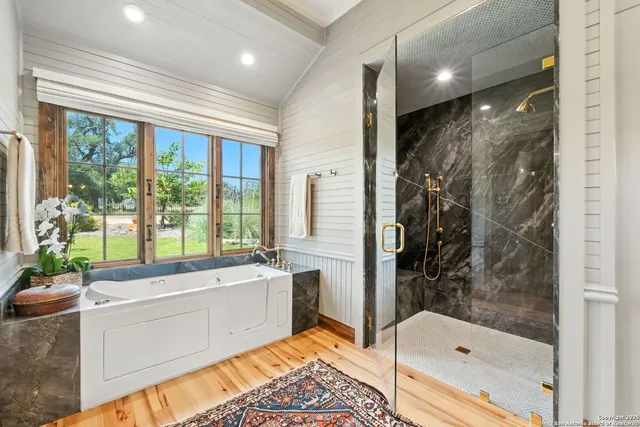 a bathroom with a toilet a sink and a window