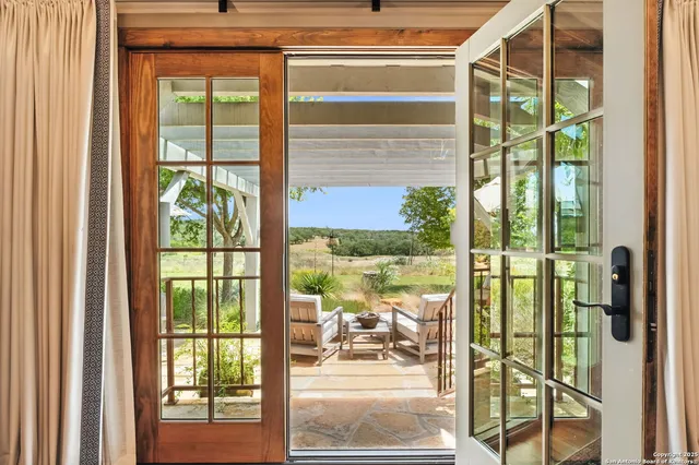 a view of a chairs and table in the garden