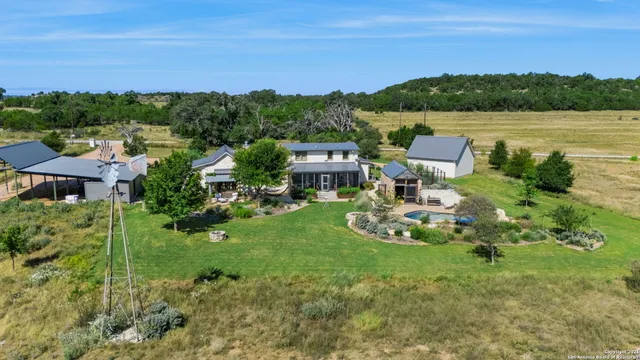 a view of swimming pool with an outdoor seating