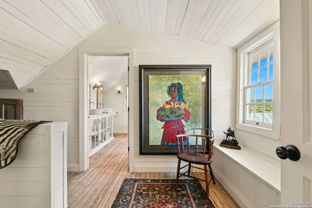 a view of lake with houses in the back