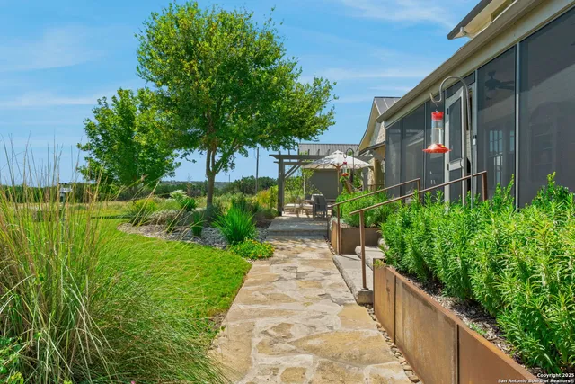 a living room with furniture a rug and a large window
