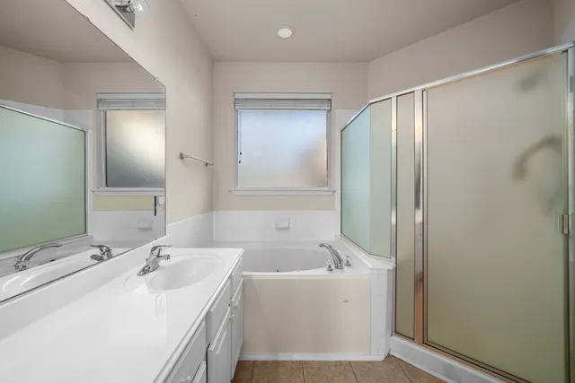 a bathroom with a bathtub and a sink