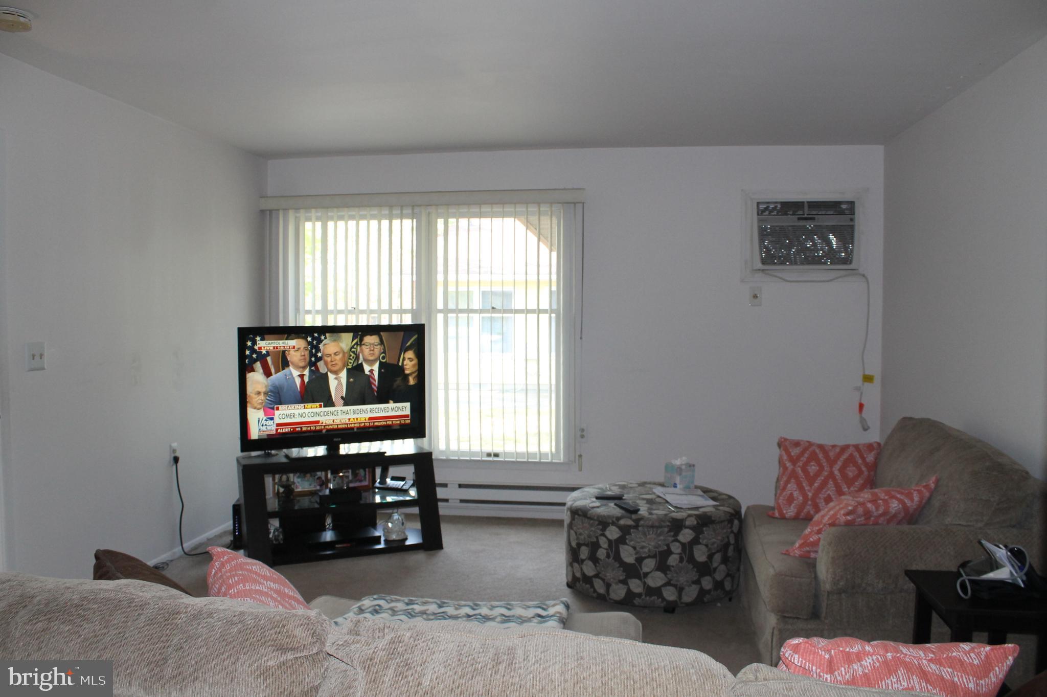 22 Cranberry Road Manahawkin, NJ 08050 - Photo 5 of 37 a living room with furniture and a flat screen tv